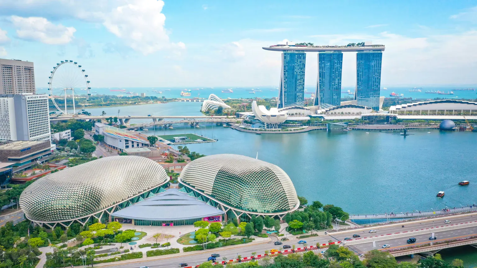 Singapore tour package showing Marina Bay Sands skyline and Sentosa Island attractions
